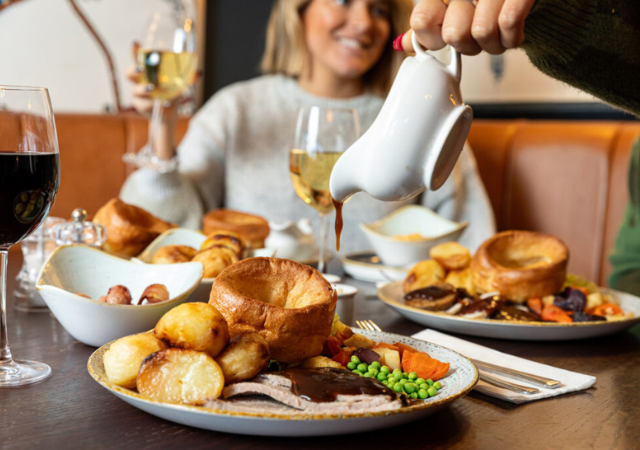 Image of people enjoying a sunday roast in a pub Image of people enjoying a sunday roast in a pub
