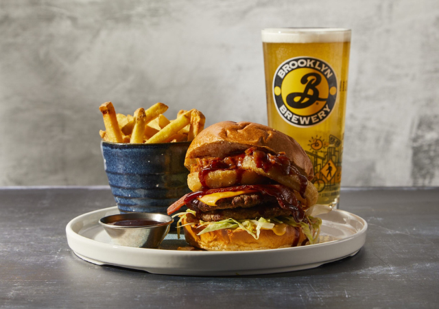 Image of burger, fries and a glass of coke of a grey backdrop Image of burger, fries and a glass of coke of a grey backdrop